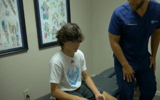 My Boy gets adjusted at the Chiropractor's office