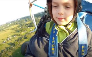 the first flight of a 9-year-old boy on a hang glider