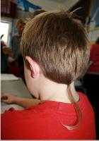 boys with a rat-tail haircut