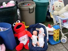 Some unused and used diapers and pull-ups with children's toys go to the landfill